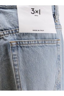 Light-wash 3x1 women’s flip blue denim jeans with white label made in Italy on the back waistband