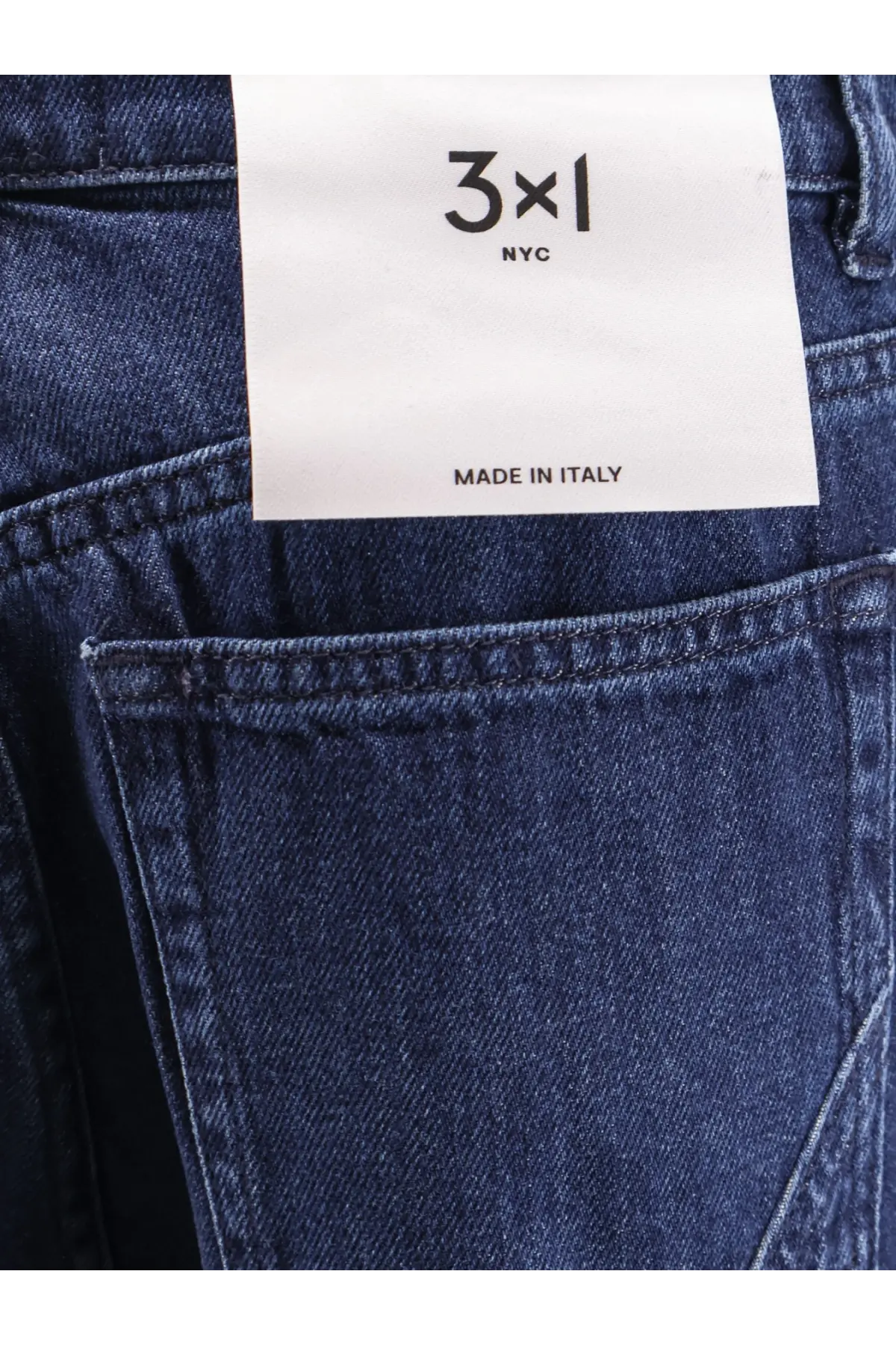 Dark blue denim 3x1 nyc womens skater boyfriend jeans featuring a white label made in italy on the back side