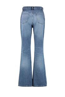 Back view of a.p.c women’s light-wash denim flare jeans with classic back pocket design in romy blue color