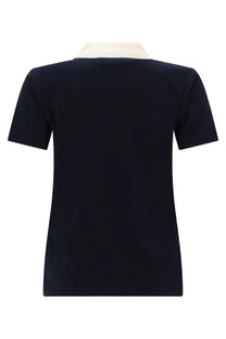 A.P.C women’s navy blue short-sleeved polo shirt with a cream collar made from soft cotton blend fabric