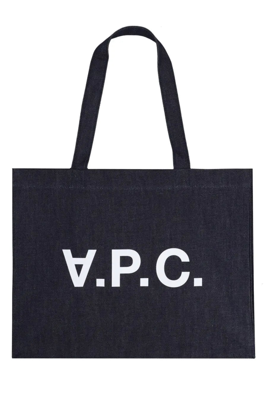 Black canvas A.P.C. tote bag with white lettering designed for women’s shopping use