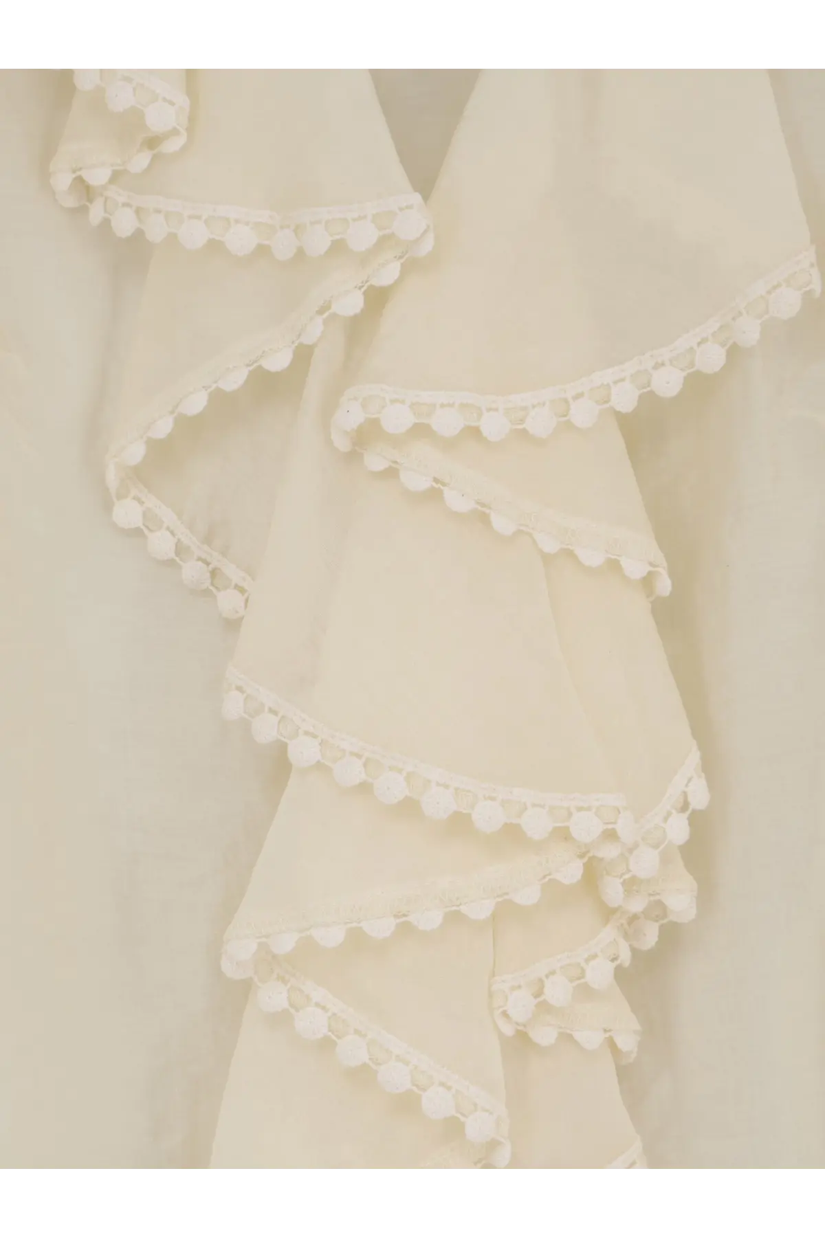 Actualee women’s white shirt with cream-colored ruffled fabric and delicate white pom-pom trim on each layer