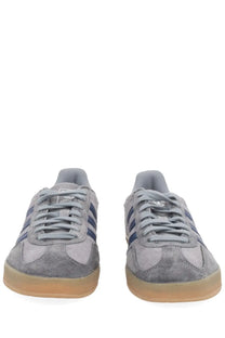 Adidas men’s gazelle indoor sneaker grey in gray suede with navy blue stripes and a translucent gum sole