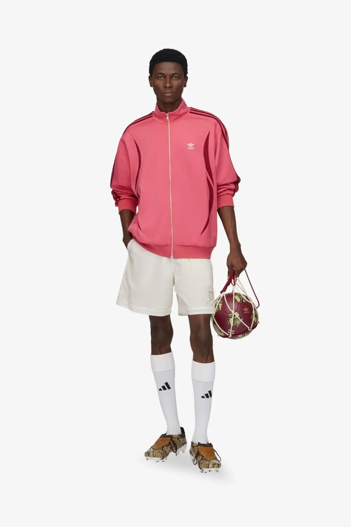 Pink adidas track jacket with red stripes and white logo made from cotton and elastane by adidas originals wales bonner