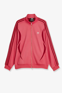 A vibrant pink adidas track jacket with bold red three stripes and logo made from cotton and elastane