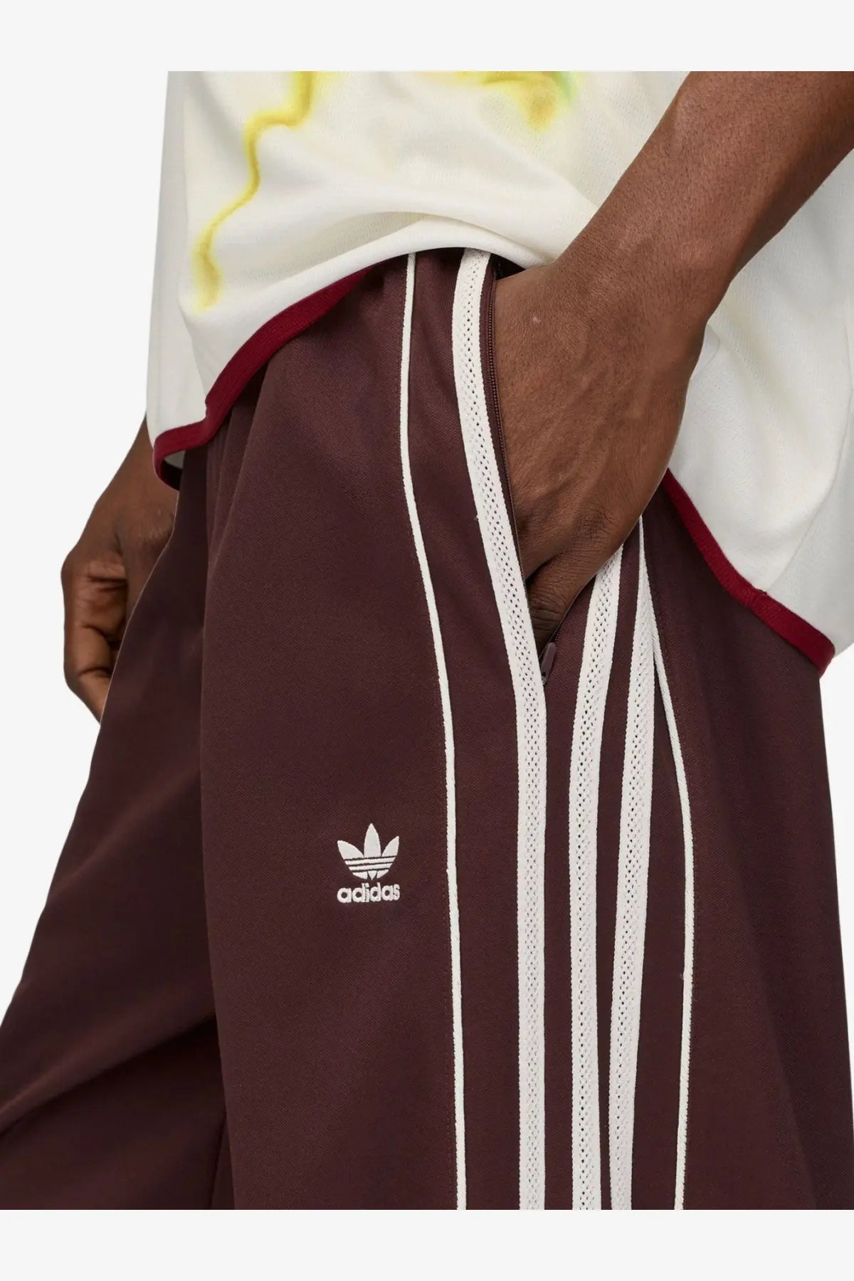 Maroon adidas Originals by Wales Bonner unisex track trousers with white three-stripe panels and embroidered logo made from recycled material
