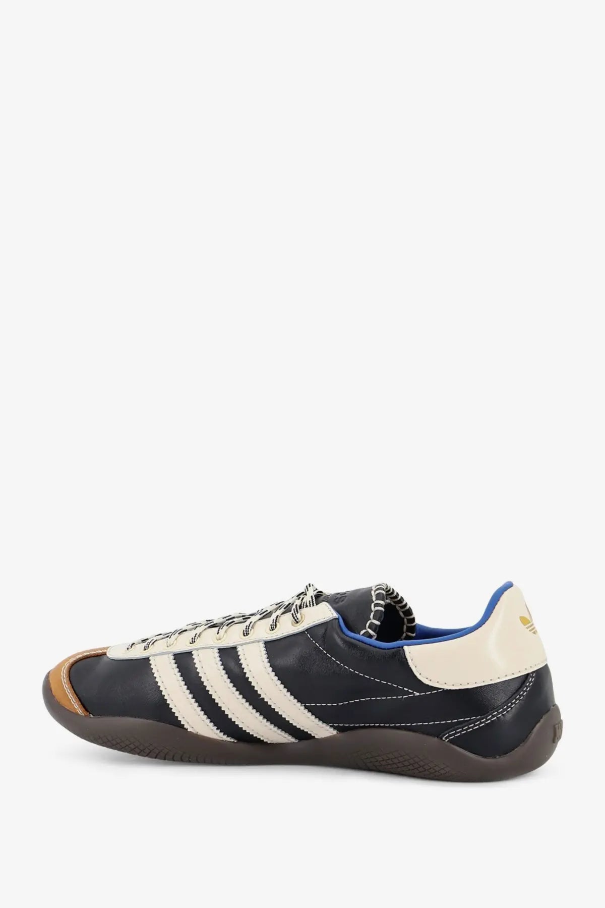 Black leather adidas originals by wales bonner unisex sneaker with cream stripes blue heel tab and tan toe cap
