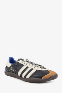 Adidas originals by wales bonner unisex wb karintha og black leather sneaker with white stripes tan toe cap and blue lining