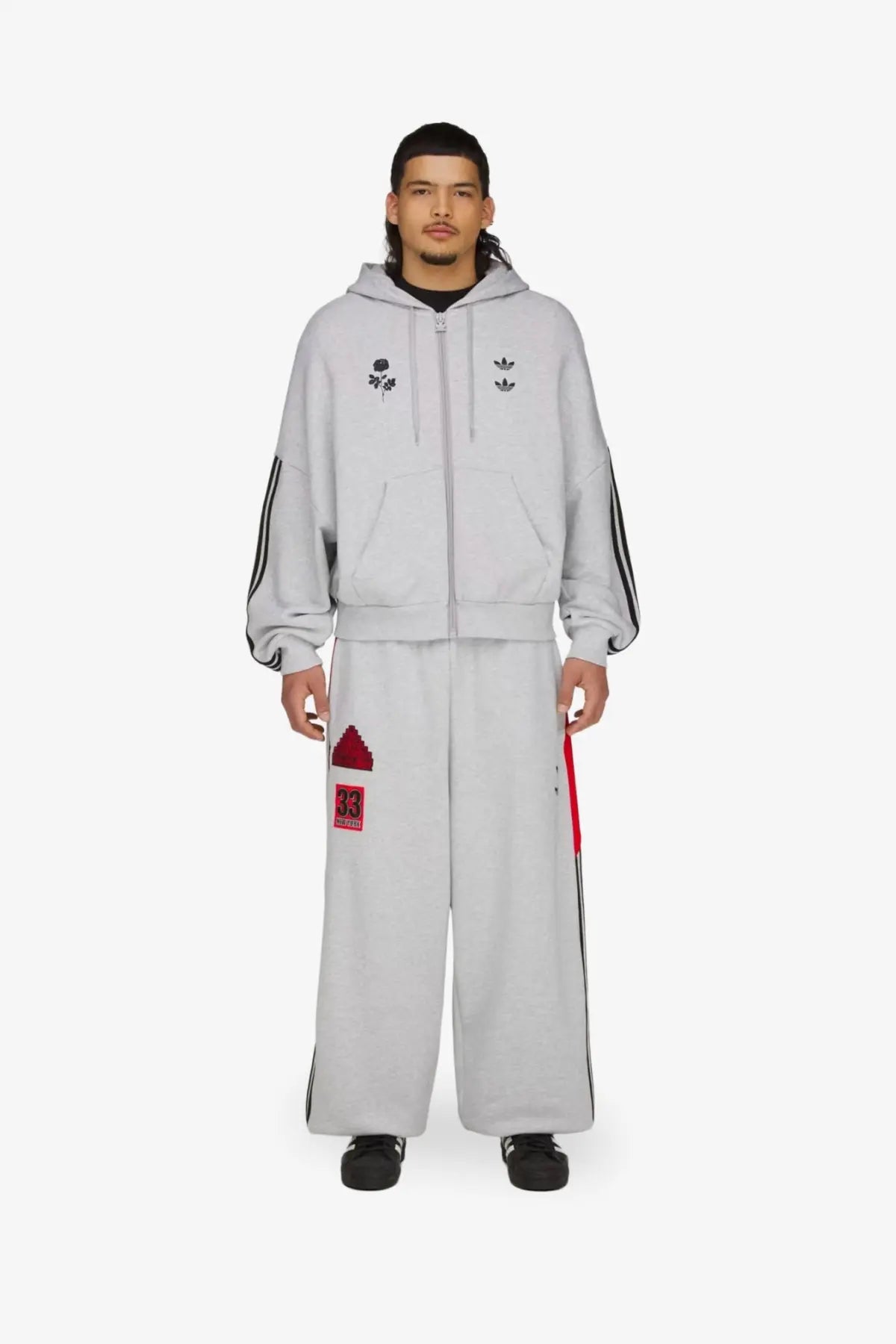Gray adidas Originals x Willy Chavarria men’s cotton blend tracksuit trousers with black stripes and red accents
