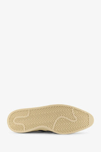 Beige rubber sole with wavy zigzag tread pattern on adidas Originals x Willy Chavarria men’s blue Chavarria Jabbar dress sneakers