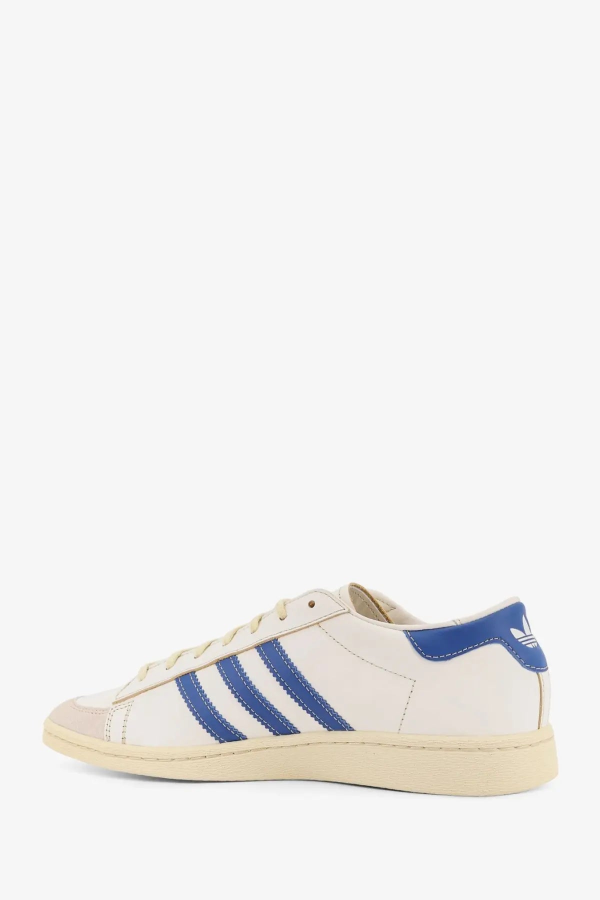 Cream-colored leather adidas Originals x Willy Chavarria men’s Chavarria Jabbar dress sneakers with blue stripes and heel tab