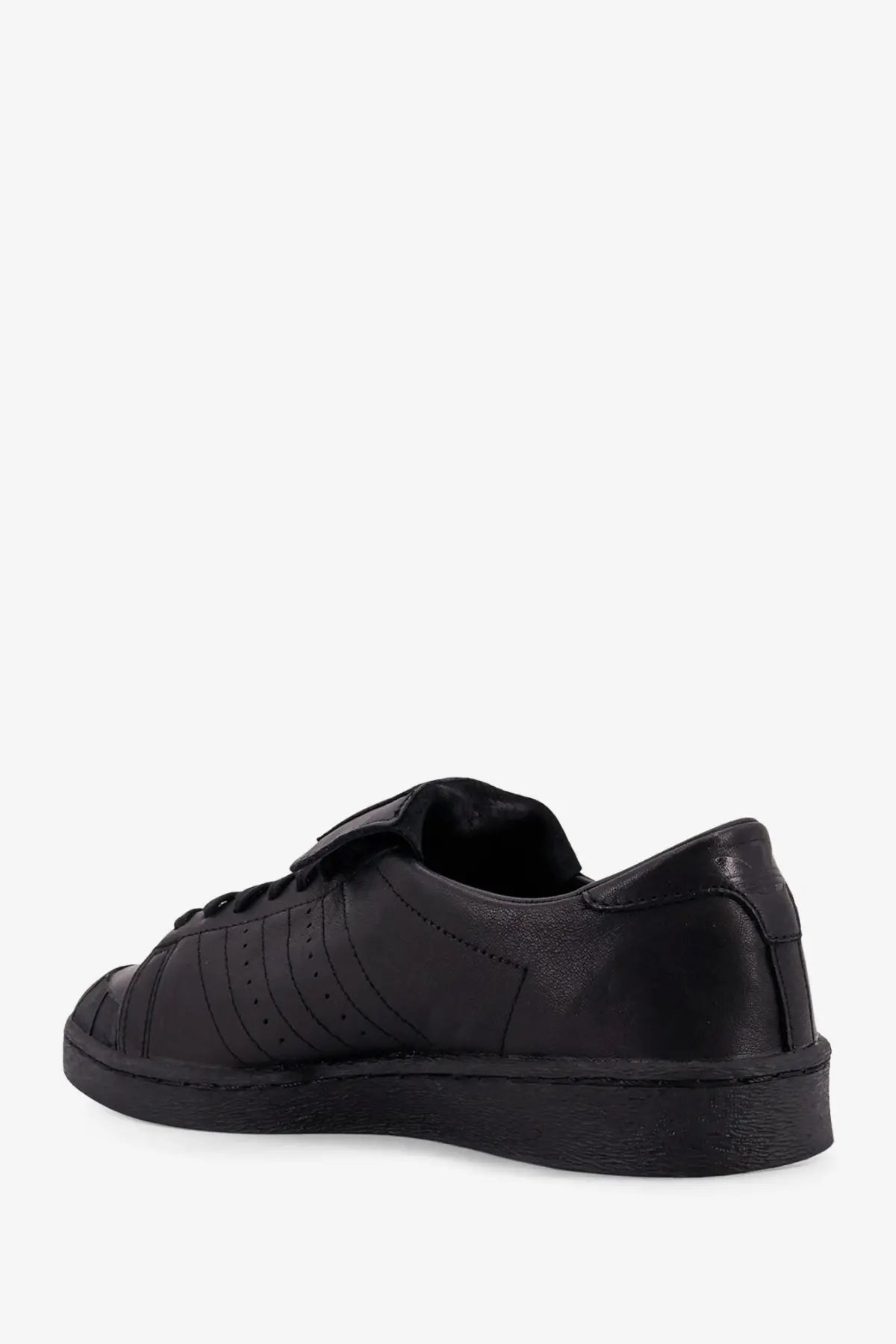 Adidas Originals x Willy Chavarria men’s black leather sneaker with classic three stripes and rubber toe cap