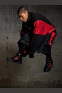 Adidas originals x willy chavarria men’s black leather sneakers with red accents three stripes rubber sole mesh upper