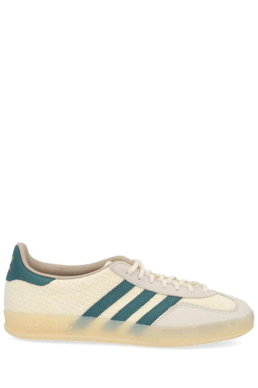 Adidas unisex gazelle indoor sneaker in cream suede with teal three stripes and a translucent gum sole
