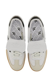 Adidas unisex sneaker samba in white with black accents featuring a textured velcro strap for easy wear