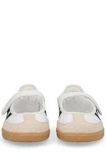 Adidas women’s samba jane sneaker in white featuring white and black suede upper with tan rubber sole