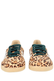 Adidas women’s samba og sneaker with leopard print, dark green laces, and white stripes in a sporty design