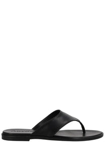 Aeyde women’s black leather thong sandal with minimalist design and subtle brand embossing on the sole