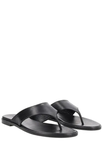 Aeyde women’s black leather thong sandal with minimalist design and flat sole for casual wear