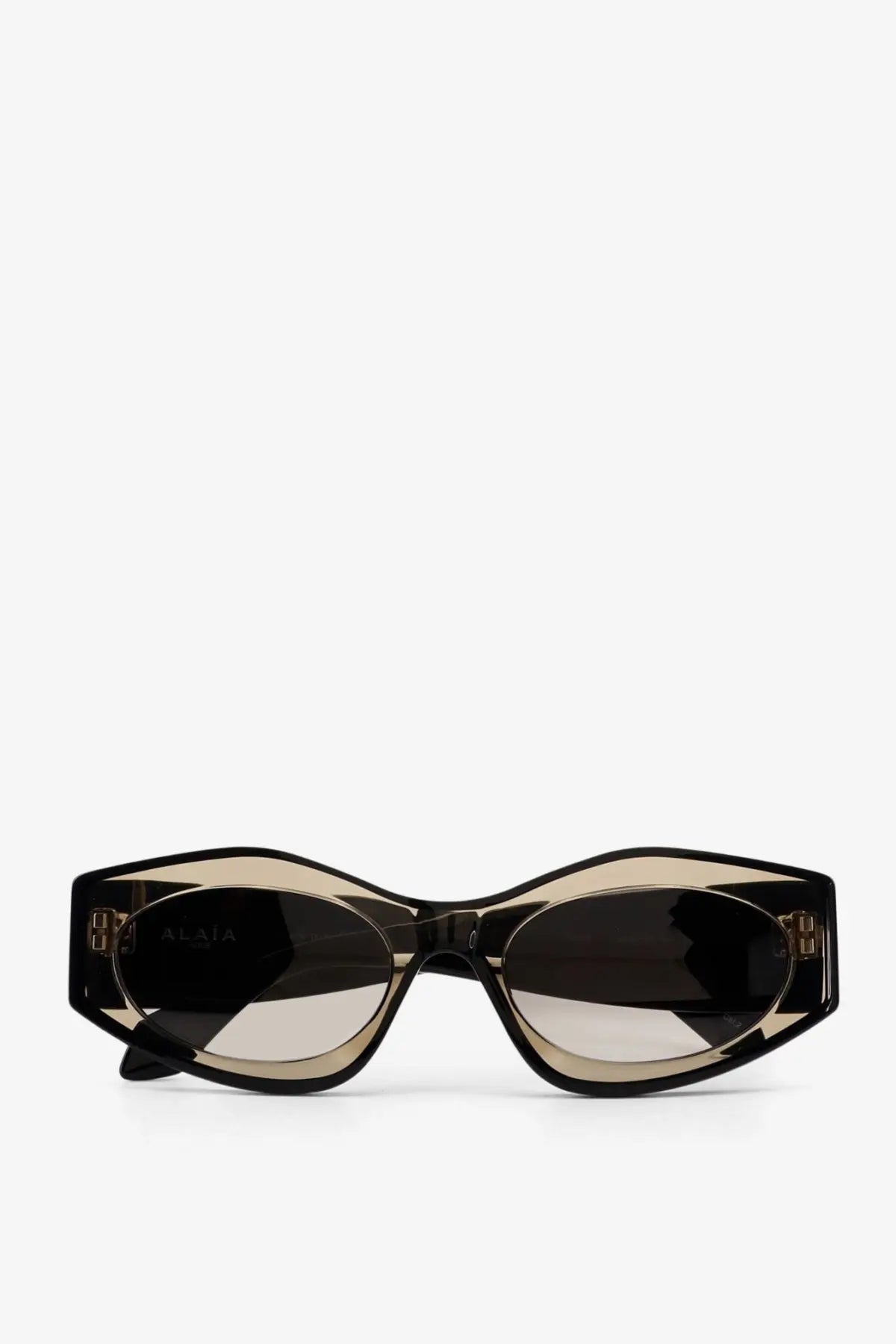 Alaïa women’s acetate sunglasses in black and gold with a sleek cat-eye frame design and grey lenses