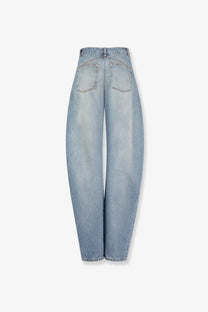 Back view of alaïa women’s faded blue light-wash denim jeans with high-rise wide-leg cut and classic back pockets