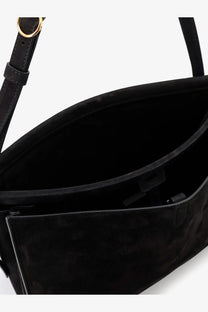 Alaïa women’s le click pocket black suede shoulder bag with gold-tone metal ring on the strap