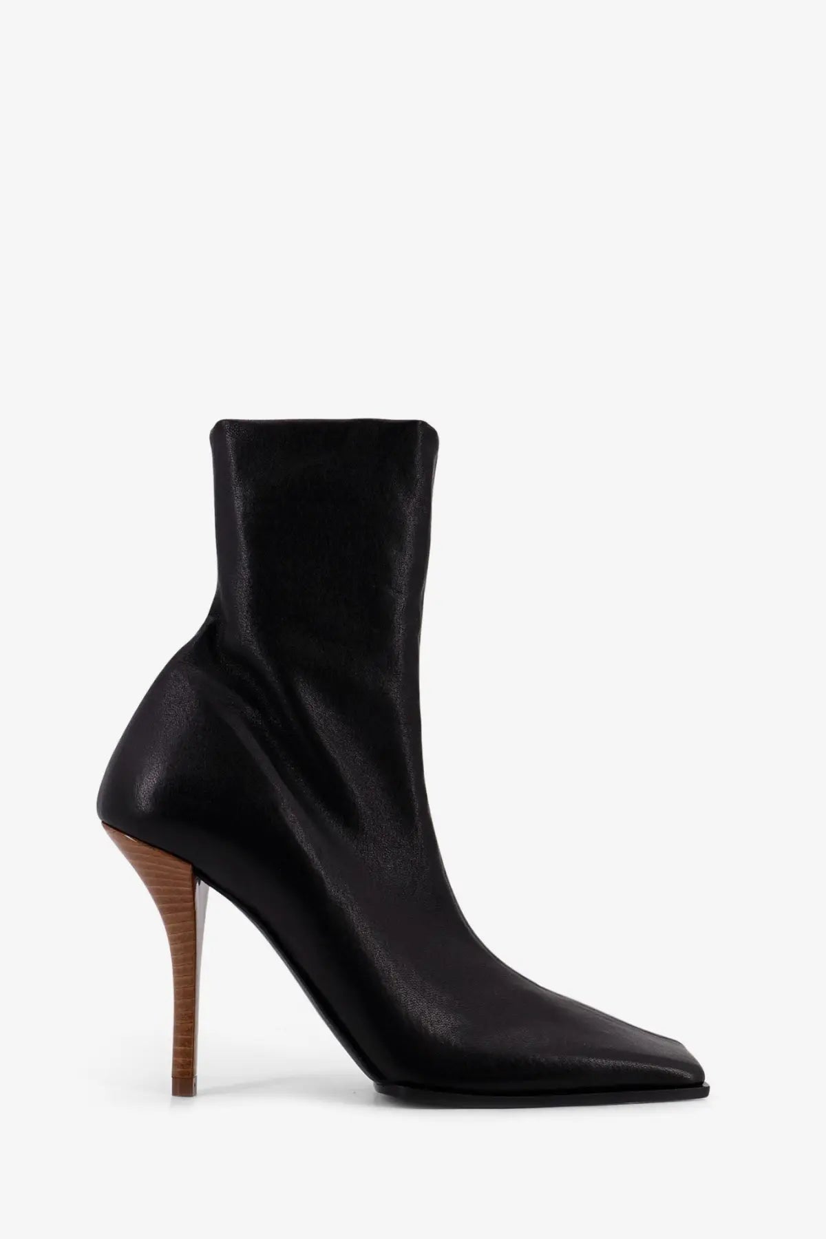 Alaïa women’s black leather ankle boot with slender wooden heel and pointed toe viewed from the back side