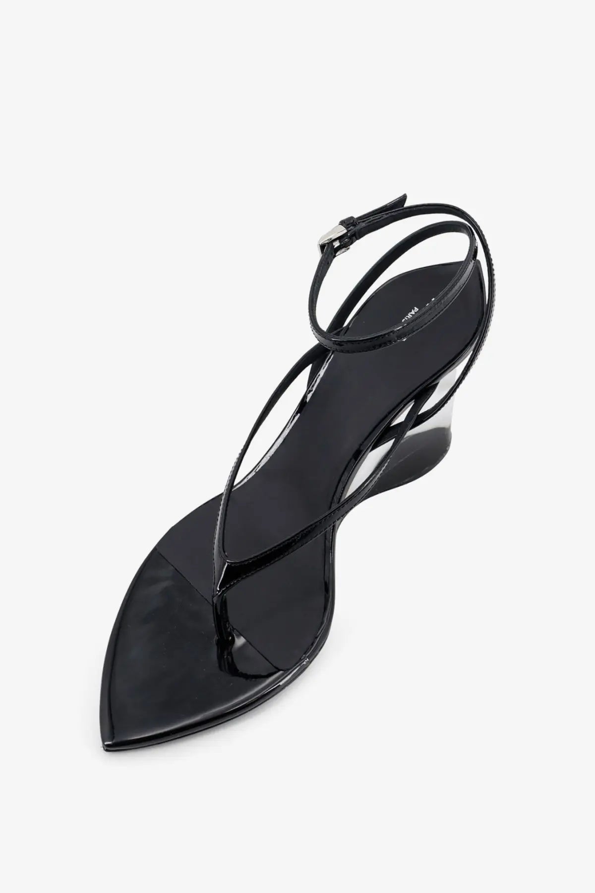 Alaïa women’s black leather thong sandal with a sleek pointed toe and ankle strap in patent leather