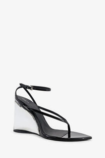 Alaïa women’s black leather wedge sandal with patent finish transparent acrylic heel and ankle strap
