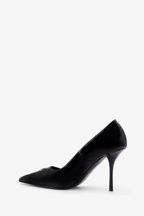Alaïa women’s black patent leather decolleté pump with pointed toe and slender high heel