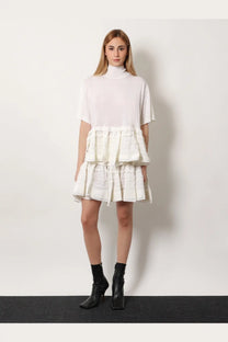 Alaïa women’s white tiered dress with high neckline short sleeves and ruffled textured fabric layers