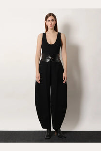 Black wide leather belt with central buckle and two side straps for ALAÏA women’s round virgin wool jumpsuit black