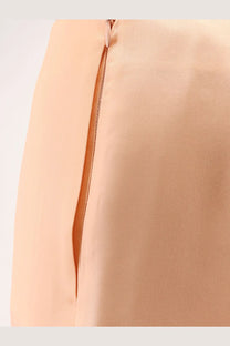 Back view of Alberta Ferretti women’s pink silk trousers with peach satin sheen and central zipper detail