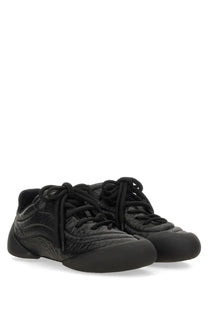 Alexander McQueen men’s flexion sneaker in black with croc-embossed leather and a sleek matte finish
