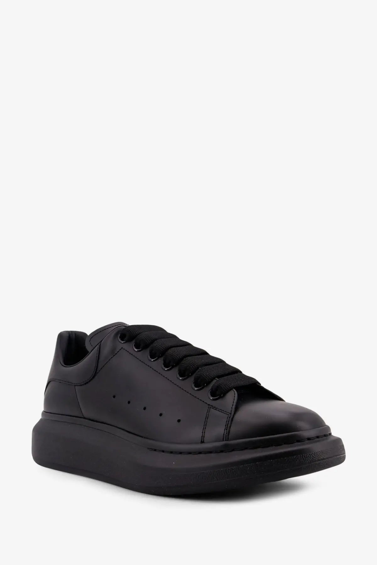 Alexander McQueen men’s black leather sneakers with sleek minimalist design and signature thick platform sole