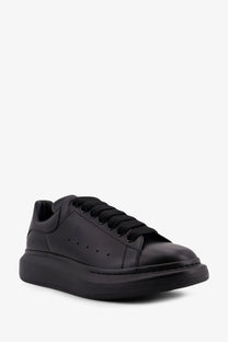 Alexander McQueen men’s black leather sneakers with sleek minimalist design and signature thick platform sole