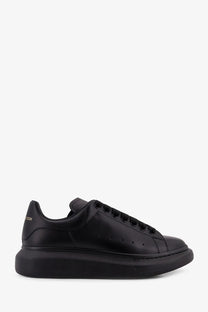 Alexander McQueen men’s black leather platform sneaker with sleek minimalist design and subtle heel branding back view