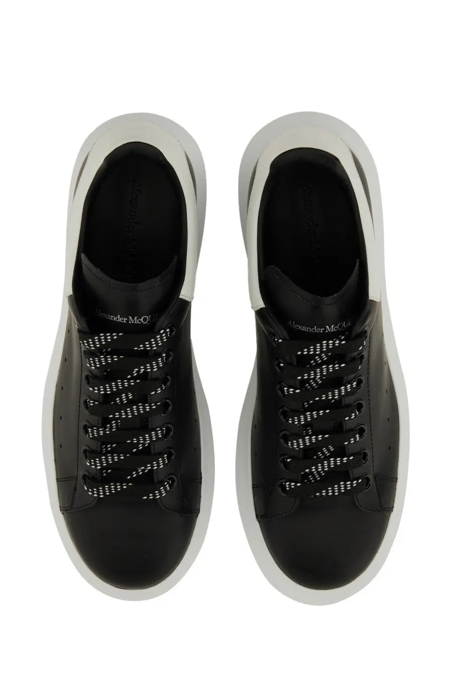 Alexander mcqueen men’s oversized sneaker black leather with white rubber soles and perforated detailing