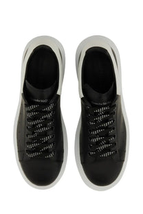 Alexander mcqueen men’s oversized sneaker black leather with white rubber soles and perforated detailing