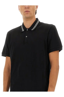 Alexander McQueen men’s black polo shirt with white striped collar and button placket in short sleeve design