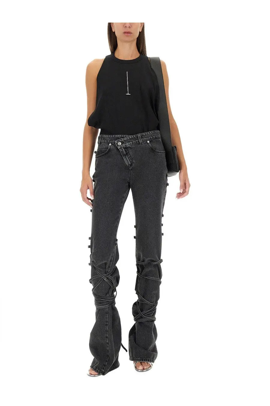 Alexander mcqueen women’s black denim jeans featuring distinctive crisscross lacing along the legs