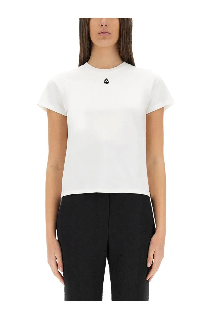 Alexander McQueen women’s white short-sleeved shirt with a small black skull emblem at the neckline