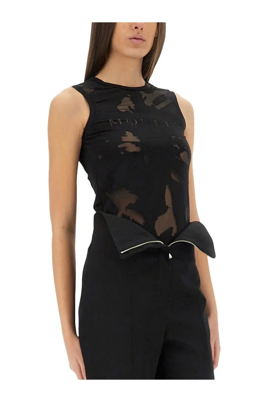 Alexander McQueen women’s black sheer mesh sleeveless top with bold abstract pattern and structured waist bow