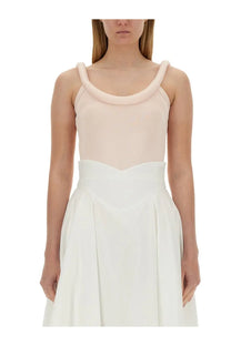 Alexander McQueen women’s blue top with blush pink sleeveless design and thick rounded neckline paired with white skirt