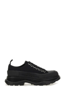 Alexander McQueen women’s tread slick sneaker black platform with chunky rubber sole and metallic eyelets