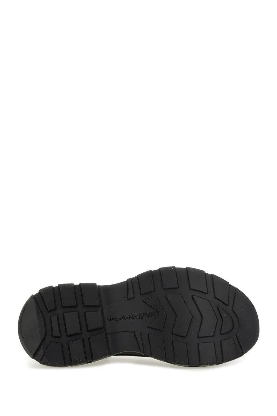 Black rubber sole with textured blocky tread and alexander mcqueen logo on alexander mcqueen women’s tread slick sneaker