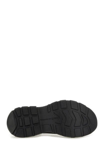 Black rubber sole with textured blocky tread and alexander mcqueen logo on alexander mcqueen women’s tread slick sneaker