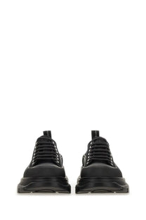 Alexander McQueen women’s tread slick sneaker black with chunky soles and lace-up design in leather material