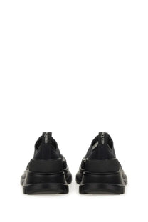 Alexander McQueen women’s tread slick sneaker black with chunky rubber sole and sleek minimalist leather design
