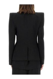 Alexander McQueen women’s black wool jacket with structured shoulders and a sleek modern silhouette
